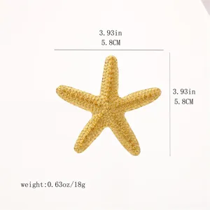 Gold starfish brooch detail shot, alloy electroplated marine life accessory for women jacket.