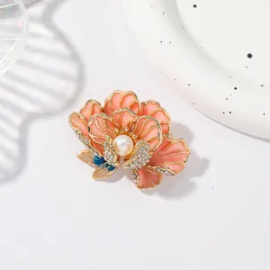 Exquisite enamel peony brooch with dazzling rhinestones and a central pearl, perfect accessory.