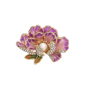Exquisite peony brooch detail featuring purple enamel petals, central pearl, and sparkling rhinestones.