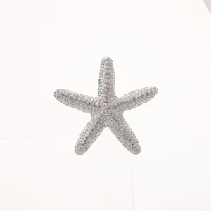 Exquisite alloy electroplated starfish brooch, detailed texture marine life clothing accessory.