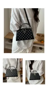Élégant sac à bandoulière noir tendance avec strass brillants et logo V pour femmes.