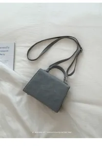 Minimalist grey top handle crossbody bag for women, stylish retro chic shoulder handbag.