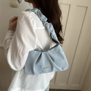 Light blue ruched shoulder bag, stylish underarm cloud bag with metallic detail for women.