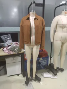 Detailed view of brown suede lapel jacket, vintage style slim fit coat for women.
