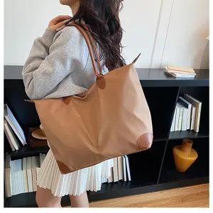 Brown nylon tote bag for women, large capacity shoulder bag with leather trim and dual handles.