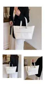Vista detallada del elegante bolso tote blanco, bolso de hombro grande para el uso diario.