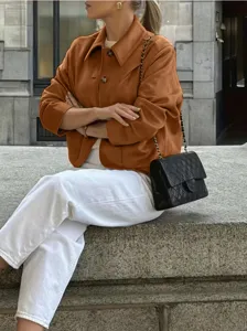 Outdoor street scene showcasing the details and styling of the stylish vintage suede jacket.