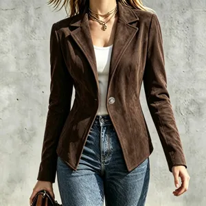 Close-up detail of a brown suede blazer featuring a classic lapel and single button design.