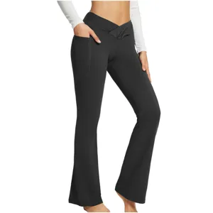 Close-up of black crossover high waist flare yoga pants with convenient side pocket detail.