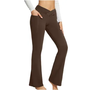 Details of high-waisted crossover flared yoga pants with convenient side pockets in brown color.