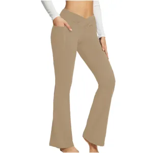 Detailed view of women's khaki crossover high waist flared yoga pants with side pockets.