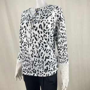 Details of women's leopard print long sleeve t-shirt with lace cuff and button henley neck.