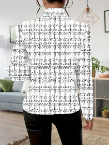 Back view detail of women's black and white printed blazer with stylish tweed texture pattern.