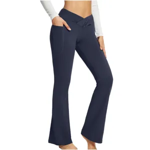 Crossover high waist yoga pants detail showing side pocket and slim fit flared leg design.