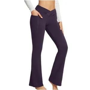High waist crossover flare yoga pants detail shot, showing side pocket design and deep purple color.
