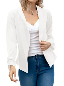 Close-up detail of the elegant white lapel blazer showing fine fabric texture and fit.