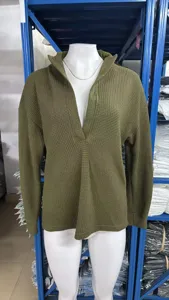 Detail shot of olive green waffle knit V-neck sweater, showing unique collar and texture.