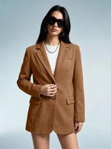 Detailed shot of women brown faux suede blazer jacket showing texture and stylish fit.