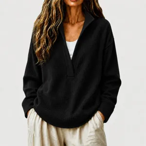 Detailed showcase of the women's black waffle knit deep V-neck casual pullover top view.
