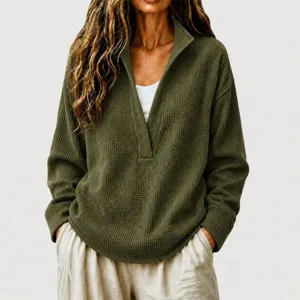 Close-up detail of the army green waffle knit long sleeve deep v-neck sweater for women.