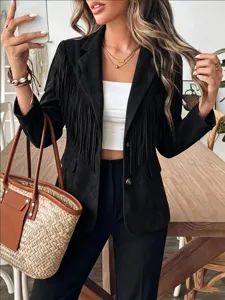 Detail shot of women's black suede fringe blazer, stylish long-sleeve short jacket for fall.