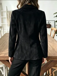 Black faux suede blazer detail showing lapel, long sleeves and premium texture in a chic home decor.