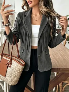 Detail view of women's fringe suede jacket, fashionable lapel short coat for autumn and winter.