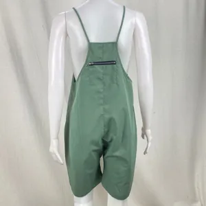 Green overall shorts for women with back zipper pocket and thin straps detailed view