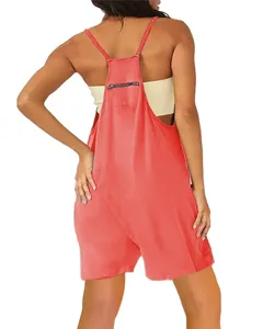 Back view detail of a stylish coral red women overall shorts with zipper pocket on back bib.