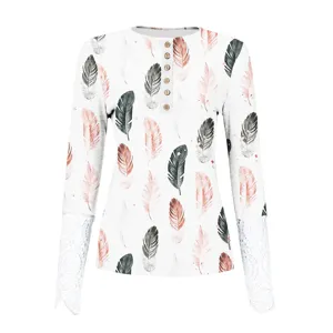 Women's long sleeve henley shirt with feather print, ribbed knit top and elegant lace cuffs.