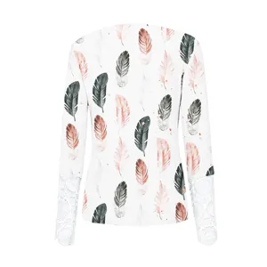 Detail view of womens long-sleeve ribbed T-shirt with delicate lace cuffs and feather print.