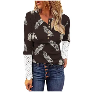 Detailed view of women's long sleeve ribbed button-front top featuring elegant lace cuffs and botanical print.