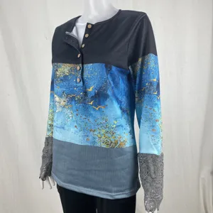 Long sleeve casual women top with button henley neck, abstract print and lace cuff details.