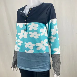 Women's long sleeve button floral print casual top with contrast lace cuffs and ribbed knit.