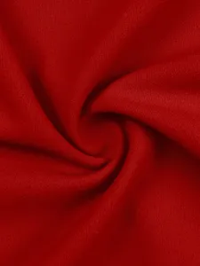 Detailed close-up of soft red textile fabric texture, showing fine knit and natural folds.
