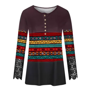 Detail view of the ethnic print pattern and black lace cuffs on this long sleeve women top.