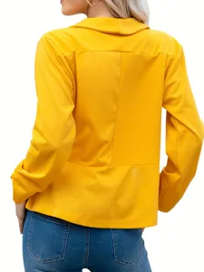 Yellow women's blazer detail view showing back design, lapel collar and long sleeves.