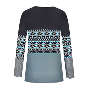 Detail view of women long sleeve colorblock geometric print top with delicate lace cuffs.