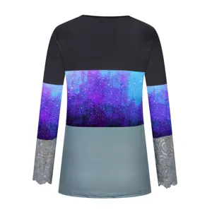 Detailed view of the women's long sleeve colorblock t-shirt with galaxy print and lace cuffs.