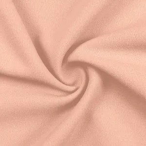 Fabric texture detail shot, smooth crepe material, solid peach nude color for custom apparel.