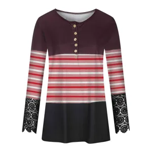 Close up of women long sleeve button top with contrast stripe panel and delicate lace cuffs.
