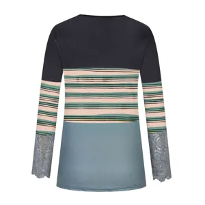 Close up of womens long sleeve color block top featuring stylish stripe pattern and lace cuffs.