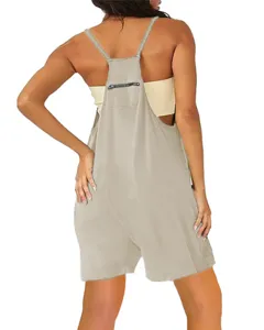 Back detail of casual khaki overall shorts featuring adjustable straps and small zipper pocket.