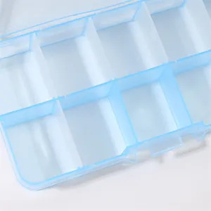 Close-up of plastic storage box details showing clear grid compartments for small parts.