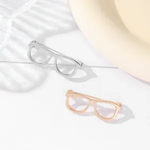 Minimalist hollow glasses frame brooch pin, creative fashion metal accessory for women.