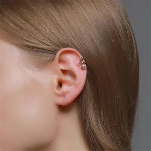 Detail view of gothic bat wing ear cuff, non-pierced metal cartilage clip jewelry piece.