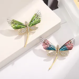 Rhinestone dragonfly brooch with acrylic wings, elegant insect pin for suit and dress detail.