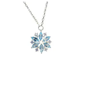 Detailed view of the exquisite blue gemstone snowflake necklace, perfect winter jewelry.