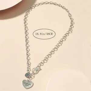 Vintage silver heart pendant necklace with trendy O-shaped clasp for women daily wear.