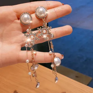 Exquisite pearl rhinestone snowflake long tassel earrings detail showing sparkling luxury design.